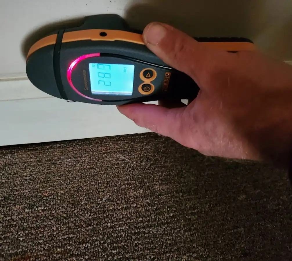 Moisture detection at baseboard during Storm Damage Restoration in Fort Myers Beach